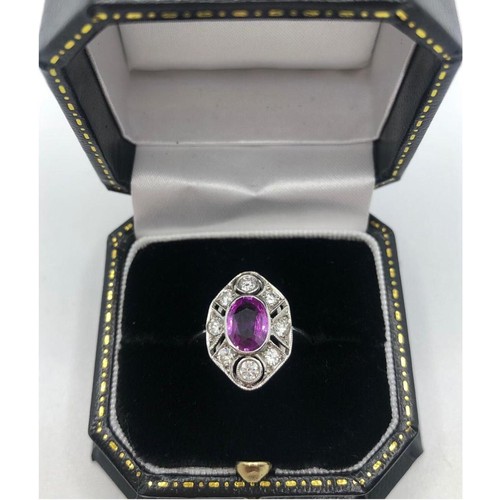 323A - AN 18CT WHITE GOLD ART DECO STYLE RING
set with oval pink sapphire surrounded by diamonds size N