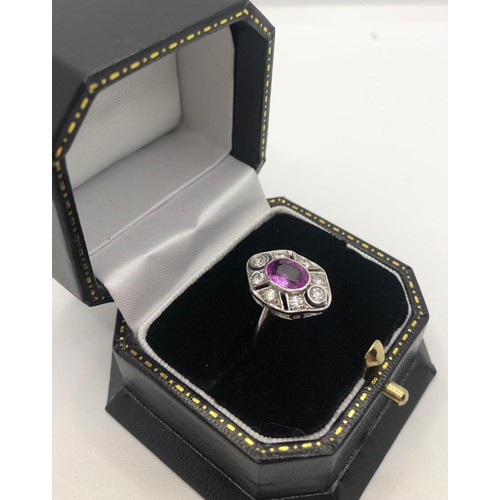 323A - AN 18CT WHITE GOLD ART DECO STYLE RING
set with oval pink sapphire surrounded by diamonds size N