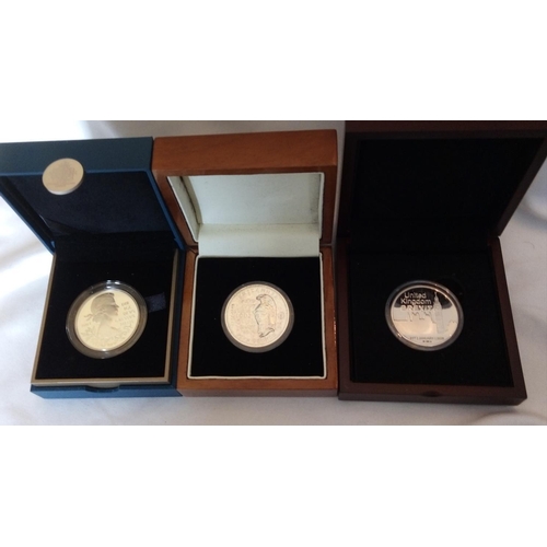 104 - THREE SILVER 1OZ COMMEMORATIVE PROOF COINS
Diamond Jubilee silver five pound coin, Tristan de Cunha ... 