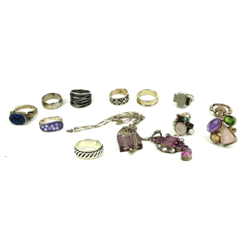 104a - A COLLECTION OF VARIOUS SILVER RINGS AND PENDANTS
Some with semiprecious stones, hallmarked London 1... 