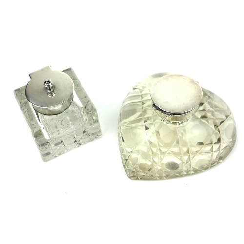 105a - A CUT CRYSTAL AND HALLMARKED SILVER DESK HEART FORM INKWELL
Along with another silver topped inkwell... 