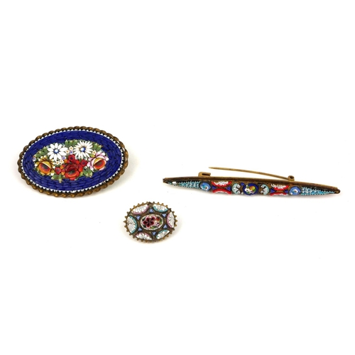 106a - THREE EARLY/MID 20TH CENTURY MICRO MOSAIC BROOCHES.
(largest 8cm)

Condition: good