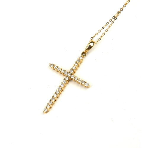 122a - A VINTAGE 14CT GOLD AND DIAMOND CRUCIFIX PENDANT
Two rows of diamonds on a fine link chain.
(pendant... 