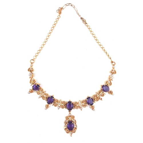 125a - A 22CT GOLD, AMETHYST AND SEED PEARL NECKLACE
Having six oval cut amethysts on fine fine pierced lin... 