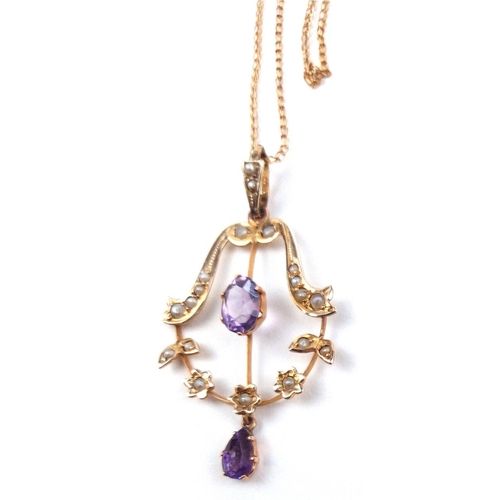 128a - AN EDWARDIAN AMETHYST AND SEED PEARL NEGLIGEE PENDANT NECKLACE
Having a central oval cut amethyst of... 