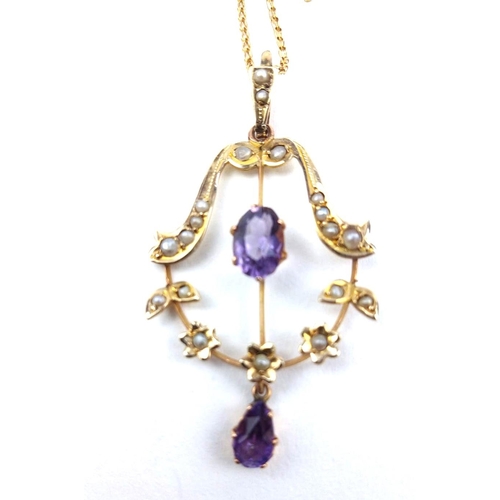 128a - AN EDWARDIAN AMETHYST AND SEED PEARL NEGLIGEE PENDANT NECKLACE
Having a central oval cut amethyst of... 