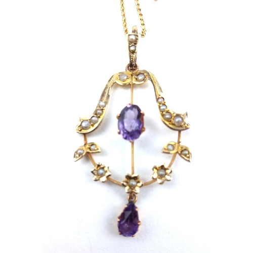 128a - AN EDWARDIAN AMETHYST AND SEED PEARL NEGLIGEE PENDANT NECKLACE
Having a central oval cut amethyst of... 