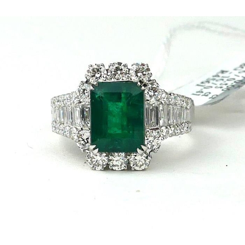 161A - AN 18CT WHITE GOLD RING SET WITH A 3.36CT EMERALD
Surrounded by 1.62ct of baguette and round brillia... 
