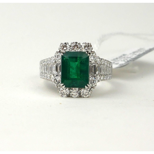 161A - AN 18CT WHITE GOLD RING SET WITH A 3.36CT EMERALD
Surrounded by 1.62ct of baguette and round brillia... 