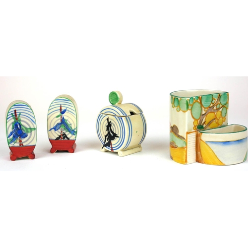 224 - CLARICE CLIFF, BIZARRE RANGE, AN UNUSUAL ART DECO COMPLETE THREE PIECE BONJOUR CRUET SET
In ‘Pine Gr... 