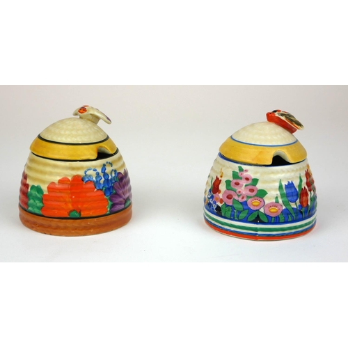 226 - CLARICE CLIFF, BIZARRE RANGE, A SMALL BEEHIVE HONEY POT AND COVER
In ‘Gayday Pattern’, painted in co... 