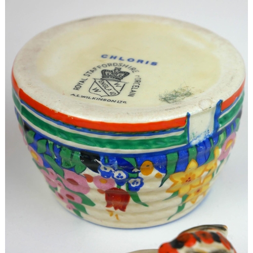 226 - CLARICE CLIFF, BIZARRE RANGE, A SMALL BEEHIVE HONEY POT AND COVER
In ‘Gayday Pattern’, painted in co... 