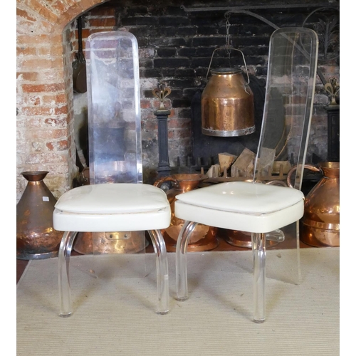 662 - A PAIR OF VINTAGE AMERICAN LUCIDE AND FAUX CREAM LEATHER CHAIRS
With bevelled lucite backs raised on... 