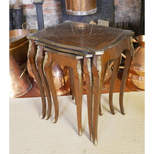 664 - A NEST OF THREE FRENCH MAHOGANY, PARQUETRY AND GILT BRONZE MOUNTED OCCASIONAL SERPENTINE TABLES
Rais... 
