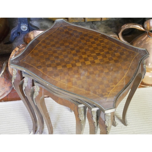 664 - A NEST OF THREE FRENCH MAHOGANY, PARQUETRY AND GILT BRONZE MOUNTED OCCASIONAL SERPENTINE TABLES
Rais... 