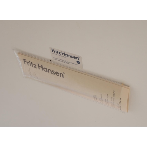 666 - FRITZ HANSEN, DESIGNED BY ARNIE JACOBSEN, AN OVAL WHITE LACQUERED DINING TABLE AND FOUR MATCHING CHA... 