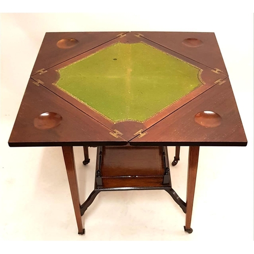 677 - AN EDWARDIAN ROSEWOOD AND MARQUETRY INLAID ENVELOPE CARD TABLE
The top decorated with urns and scrol... 