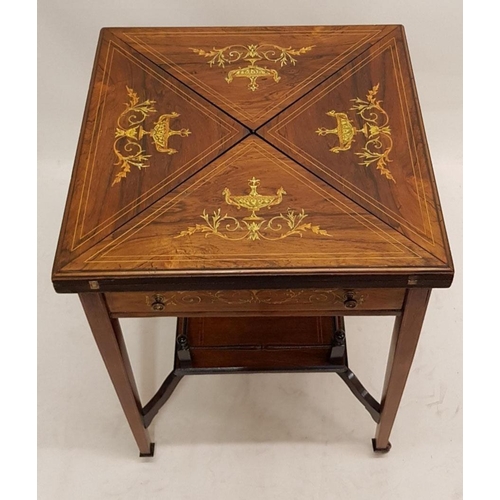677 - AN EDWARDIAN ROSEWOOD AND MARQUETRY INLAID ENVELOPE CARD TABLE
The top decorated with urns and scrol... 