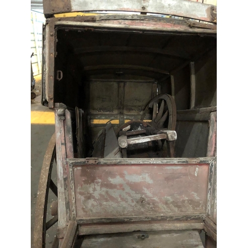 678 - A LATE VICTORIAN WOODEN TRADESMAN COVERED HAND CART
Branded E. Simmons and Son, iron bound spoke whe... 