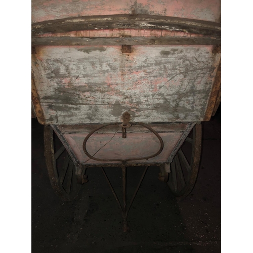 678 - A LATE VICTORIAN WOODEN TRADESMAN COVERED HAND CART
Branded E. Simmons and Son, iron bound spoke whe... 