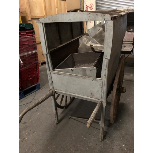679 - AN EDWARDIAN WOODEN TRADESMANS COVERED HAND CART
Light grey painted finish, iron bound spoke wheels.... 
