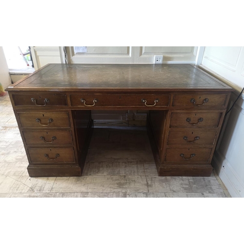 681 - A REGENCY STYLE MAHOGANY PARTNERS DESK
With green tooled leather top above an arrangement of nine dr... 