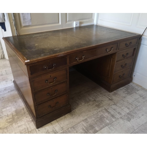 681 - A REGENCY STYLE MAHOGANY PARTNERS DESK
With green tooled leather top above an arrangement of nine dr... 