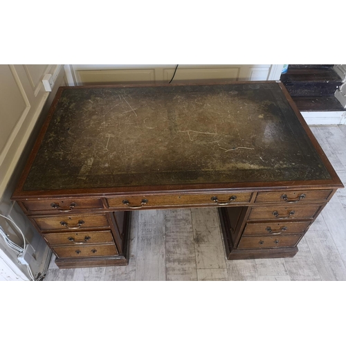 681 - A REGENCY STYLE MAHOGANY PARTNERS DESK
With green tooled leather top above an arrangement of nine dr... 
