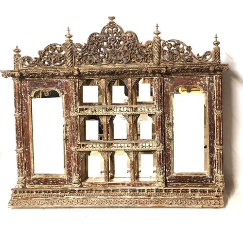 685 - A VENETIAN DESIGN WALL MOUNTED MIRRORED BACK CABINET
With pierced floral fretwork pediment above gal... 