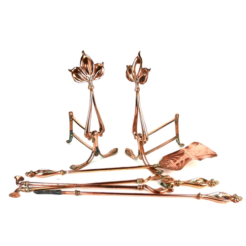689 - A SET OF ART NOUVEAU COPPER FIRE IRONS AND DOGS
Comprising a shovel, tongs, poker and matching fire ... 
