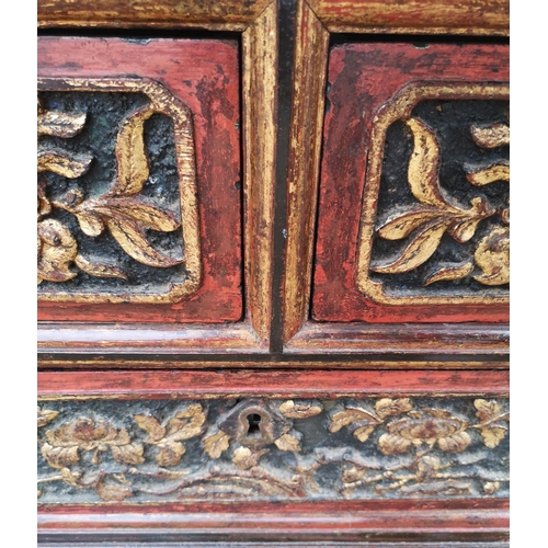 690a - A 19TH CENTURY CHINESE LOW CHEST OF TWO SHORT ABOVE ONE LONG DRAWER
With red lacquered and organic c... 