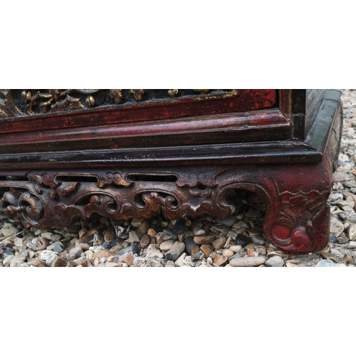 690a - A 19TH CENTURY CHINESE LOW CHEST OF TWO SHORT ABOVE ONE LONG DRAWER
With red lacquered and organic c... 