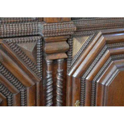 700 - AN IMPRESSIVE 17TH CENTURY DUTCH OAK CABINET
With dentil cornice above four ribbed panelled doors ce... 