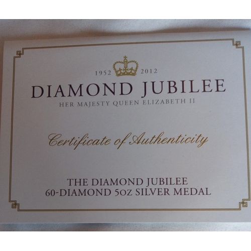 83 - A SILVER 5OZ COMMEMORATIVE PROOF COIN, DATED 2012, DIAMOND JUBILEE 
In a protective capsule and fitt... 
