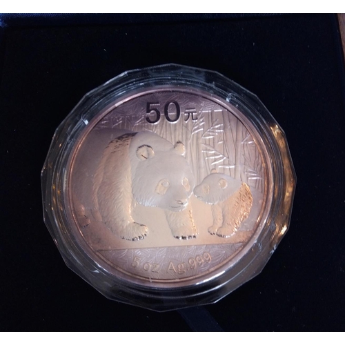 85 - A SILVER 5OZ CHINESE PANDA COMMEMORATIVE PROOF COIN, DATED 2011 
In a protective capsule and fitted ... 
