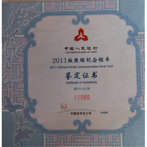 85 - A SILVER 5OZ CHINESE PANDA COMMEMORATIVE PROOF COIN, DATED 2011 
In a protective capsule and fitted ... 