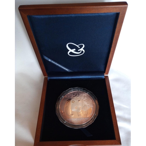 85 - A SILVER 5OZ CHINESE PANDA COMMEMORATIVE PROOF COIN, DATED 2011 
In a protective capsule and fitted ... 