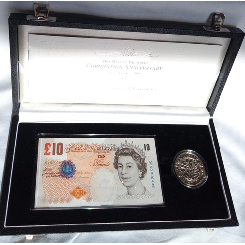 97 - A SILVER COMMEMORATIVE ONE CROWN AND TEN POUND BANKNOTE PROOF  SET, DATED 2003
In a protective capsu... 