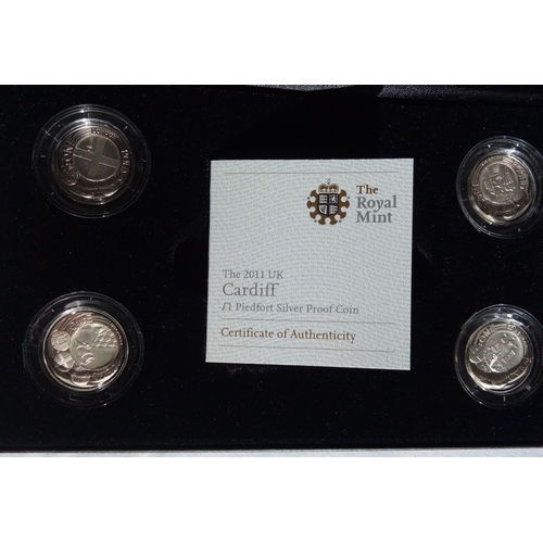 99 - A SILVER FOUR PIEDFORT ONE POUND COIN PROOF SET
Including Cardiff, Belfast, London and Edinburgh, in... 
