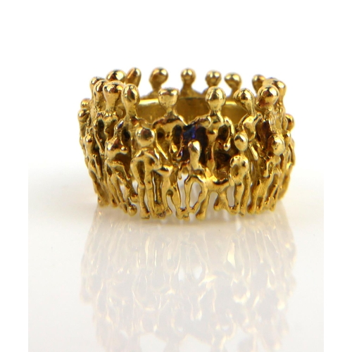 STUART DEVLIN, AN 18CT GOLD FIGURAL RING Having two layers of figures ...