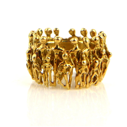 STUART DEVLIN, AN 18CT GOLD FIGURAL RING Having two layers of figures ...