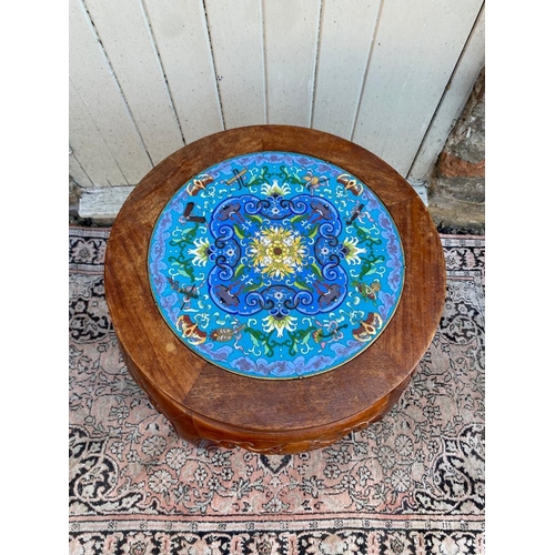 778 - A PAIR OF CHINESE HARDWOOD PLANT STANDS
The circular top inset with floral decorated cloisonné round... 