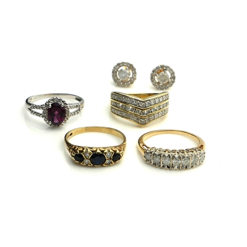 394 - A COLLECTION OF 9CT GOLD, DIAMOND AND GEM SET JEWELLERY
To include a three row diamond ring, a seven... 