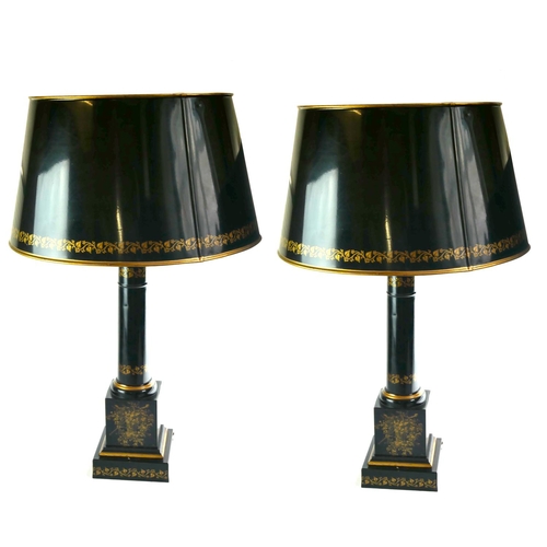 412 - A PAIR OF REGENCY STYLE TOLEWARE TABLE LAMPS AND SHADES 
With gilt floral decoration, on a black gro... 