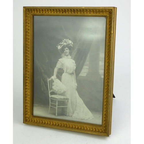 416 - LIBERTY & CO., LONDON AND PARIS, AN EDWARDIAN PERIOD GILTWOOD TABLE PHOTOGRAPH FRAME
Having original... 