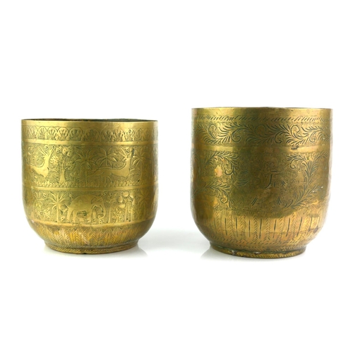 421 - A PAIR OF INDIAN BRASS JARDINIERES
Having fine engraved decoration of hunting figures with exotic an... 