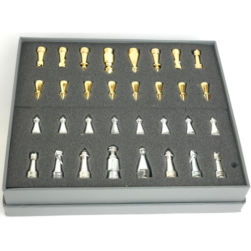 437 - STAR TREK, A CASED TRIDIMENSIONAL CHESS SET
Issued by the Franklin Mint with gold and silver plated ... 