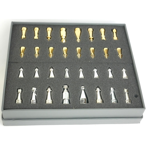 437 - STAR TREK, A CASED TRIDIMENSIONAL CHESS SET
Issued by the Franklin Mint with gold and silver plated ... 