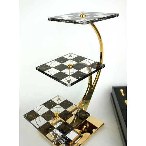 437 - STAR TREK, A CASED TRIDIMENSIONAL CHESS SET
Issued by the Franklin Mint with gold and silver plated ... 