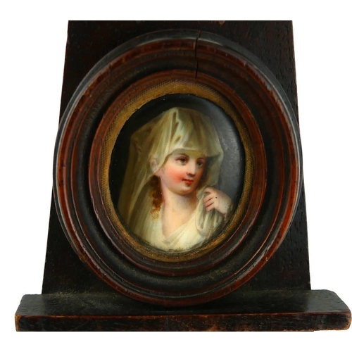 441 - A CONTINENTAL OVAL PORTRAIT MINIATURE
Young maiden, set in a table easel. 
(overall 6cm)

Condition:... 